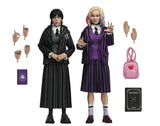 **Pre Order**NECA WEDNESDAY - 8 IN CLOTHED - WEDNESDAY ADDAMS (NEVERMORE UNIFORM) AND ENID 2 PACK Action Figure